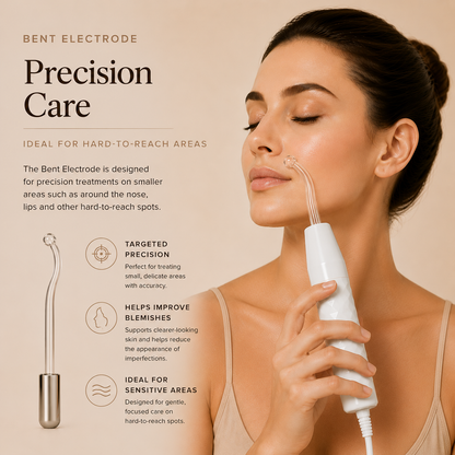 Glass high-frequency wand electrode emitting violet argon glow during facial treatment