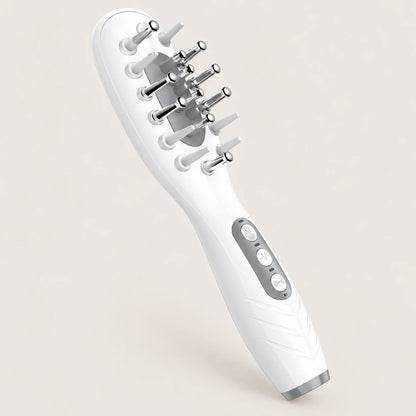 White EMS LED scalp massage comb on a warm beige background