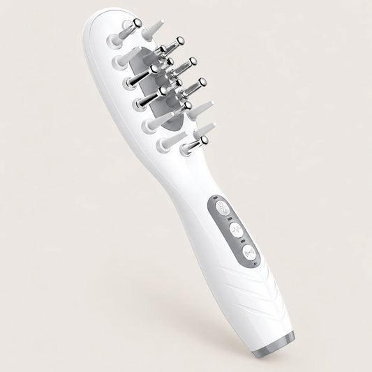 White EMS LED scalp massage comb on a warm beige background