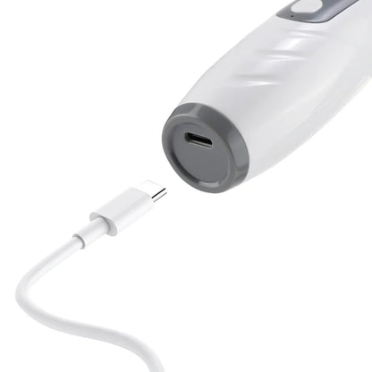 USB-C charging port on the base of the white scalp comb