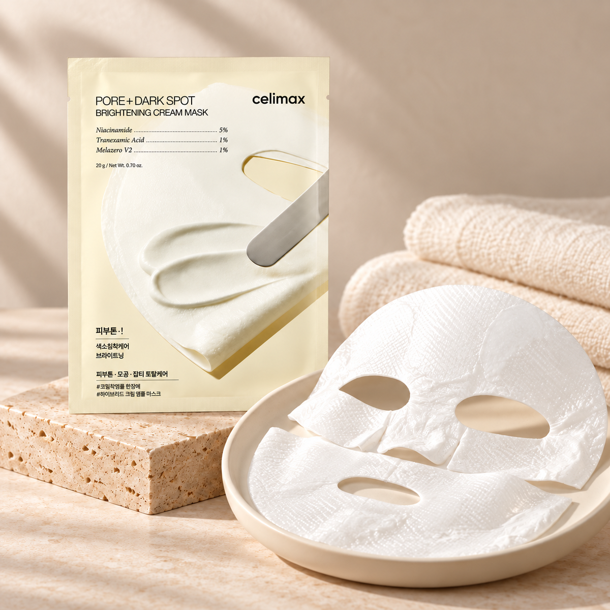 Celimax cream sheet mask sachet and two-piece mask arranged on an ivory tray — styled product illustration