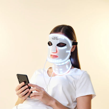 Step-by-step demonstration of applying the wireless LED face and neck mask, soft studio lighting