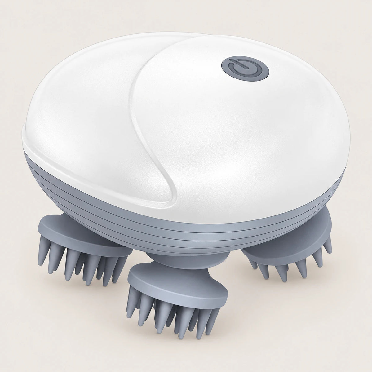 White electric scalp massager with four grey silicone kneading heads on a light beige background