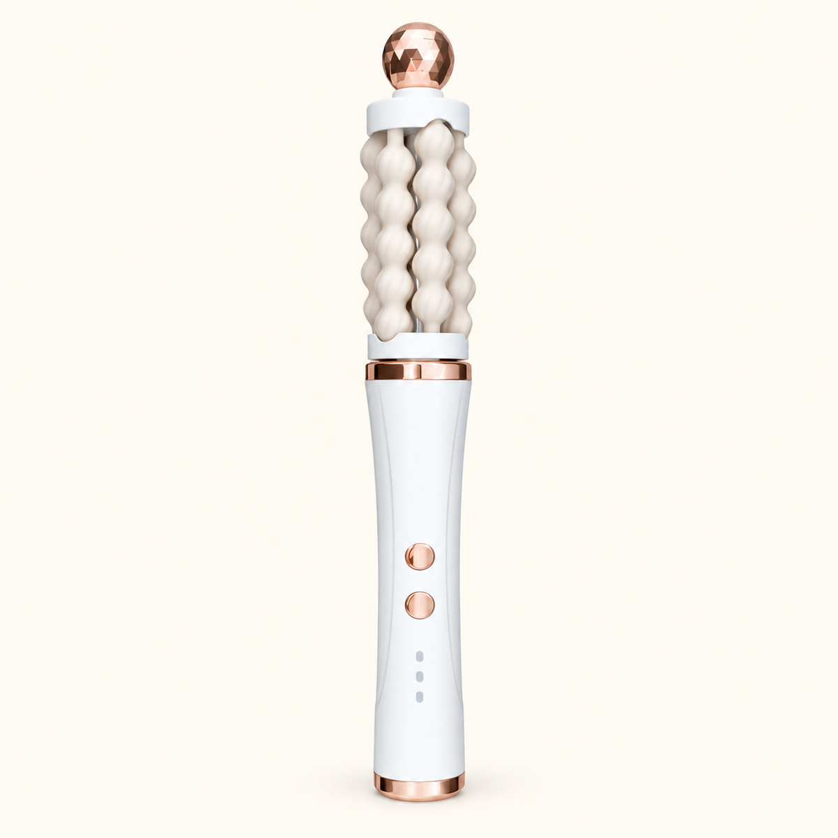 White 3D Wave rotating facial massager with cream fluted rollers and rose-gold-toned accents