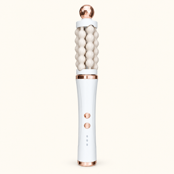 White 3D Wave rotating facial massager with cream fluted rollers and rose-gold-toned accents