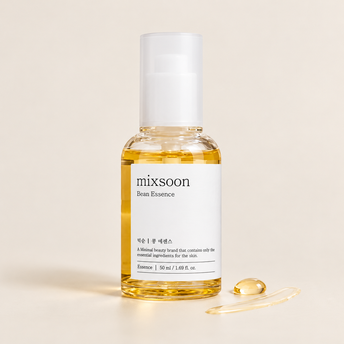 Mixsoon Bean Essence 50 ml bottle with a pale golden essence drop and smear