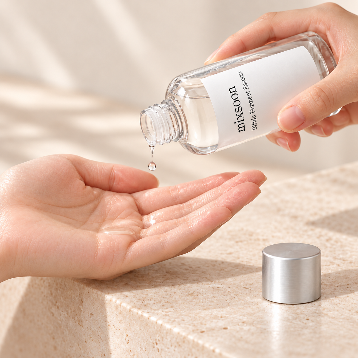 Illustration of pouring Bifida essence into a clean palm with the label aligned to the bottle