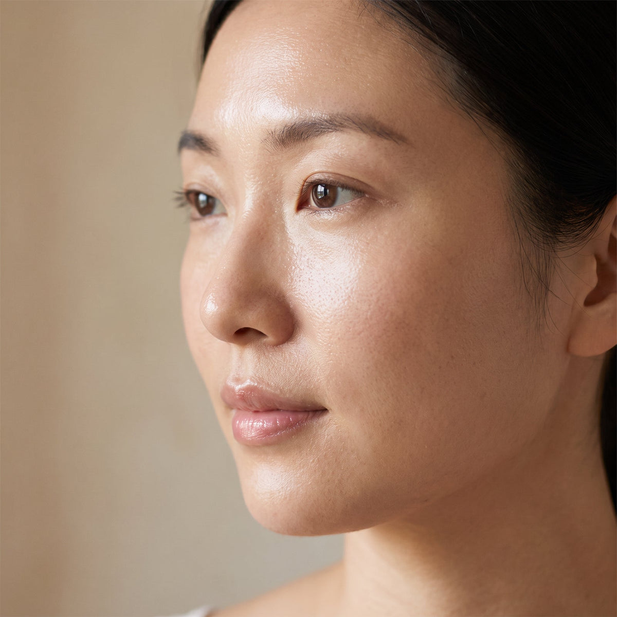Close-up beauty portrait showing smooth, radiant, firm-looking skin