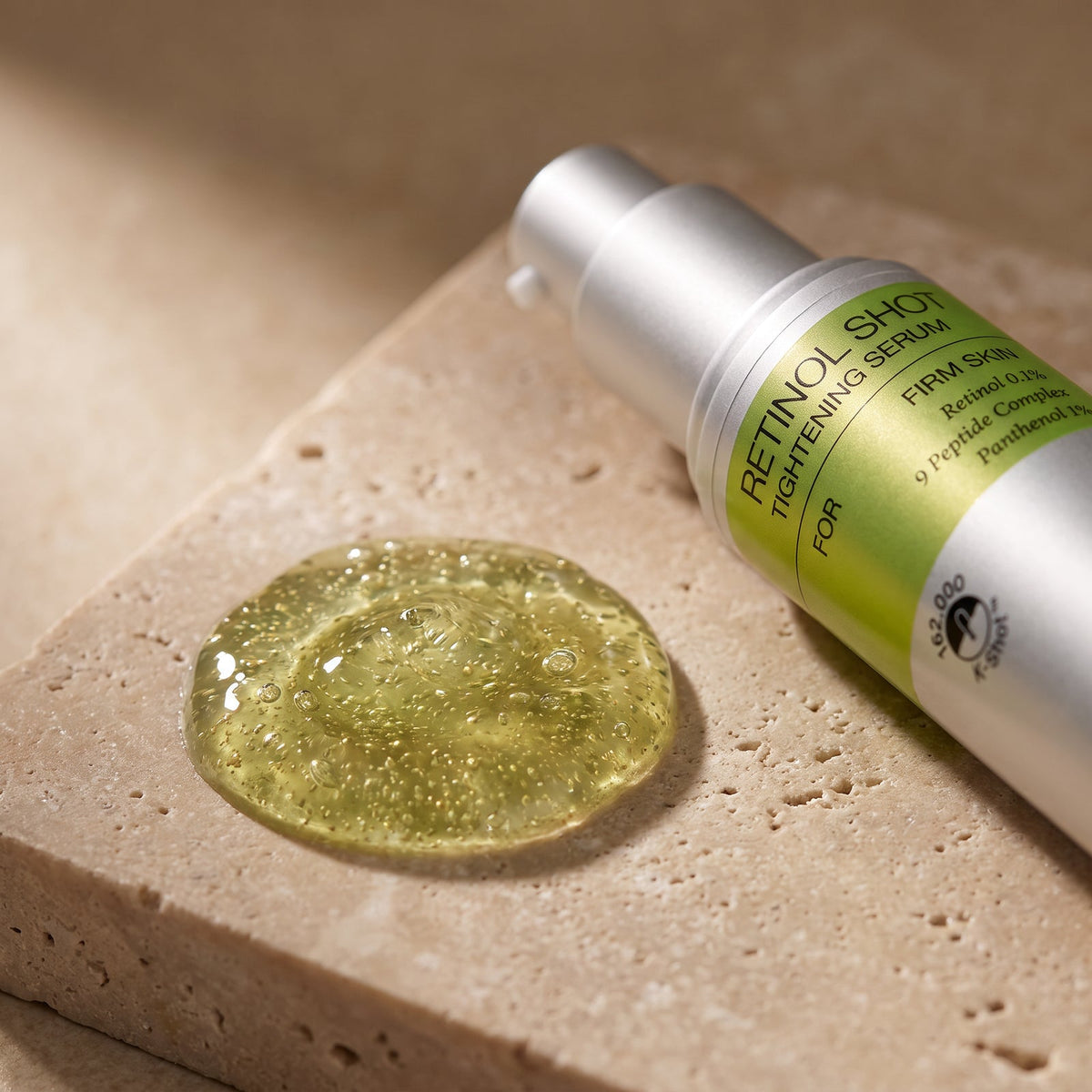 Macro view of Celimax Retinol Shot Tightening Serum gel texture beside the bottle
